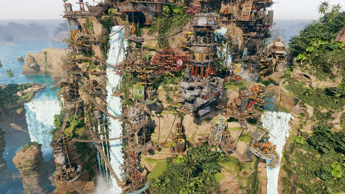 Corsair Cove aerial view of a pirate settlement built into a jungle cliff, with rope bridges, waterfalls and stacked wooden buildings above a turquoise bay