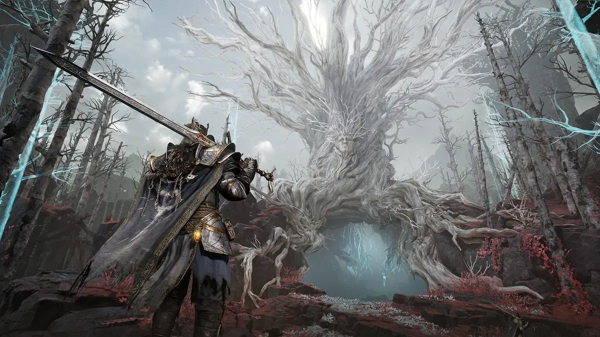Mistfall Hunter armoured warrior with a greatsword facing a huge pale tree with a face in its trunk, in a bleached forest lit by blue light shafts